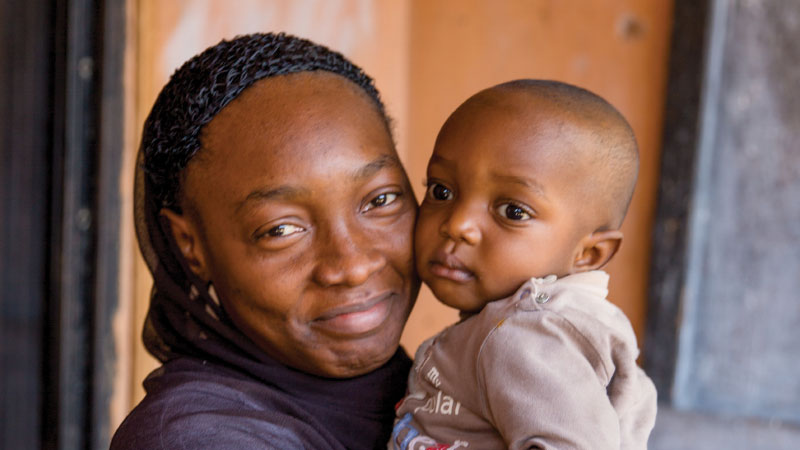 mother holding her baby holding her baby