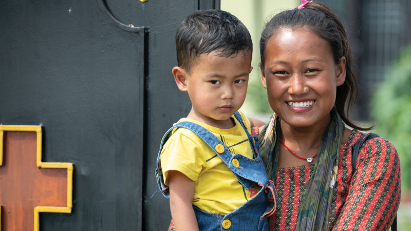 mother holding her toddler mother holding her toddler